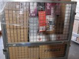 a metal cart with boxes on top of it in a warehouse