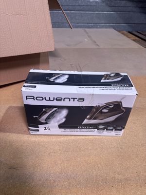 packaging of a black and white steam iron sitting on the floor
