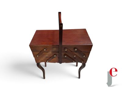 a small wooden table with a drawer on top of it