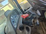 a view of the inside of a tractor from the driver ' s seat