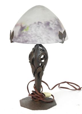a lamp that has a glass shade on it