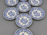six blue and white plates with floral designs on them