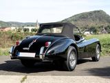 a black sports car parked on the side of the road