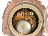 a close up of a clock that is on a table