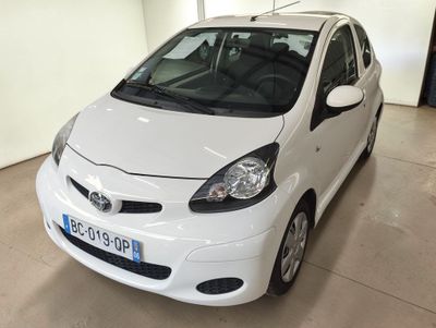 a white car that is parked in a garage