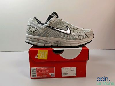 nike air zoom running shoes in a box on a white surface