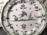 three plates that have birds on them on them