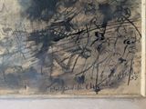 a picture of a black and white painting on a wall