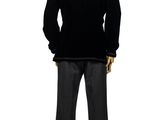 a male mannequin dressed in a black suit and tie