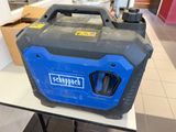 un générateur portable bleu et noir posé sur une table