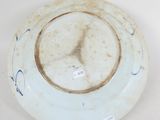 a white plate with a blue and white design on it