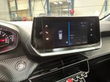 the dashboard of a car with a digital display in the center