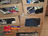 many boxes of clothes stacked on top of each other