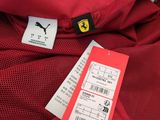 a close up of a red jacket with a tag on it