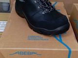 a box with a pair of black shoes on it