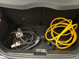 a trunk of a car with a bunch of wires in it