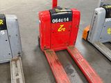 two forklifts that are sitting next to each other in a warehouse