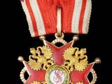 une image représentant une médaille ornée d'une étoile rouge