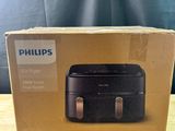 emballage d'une friteuse à air chaud Philips posé sur une table en bois