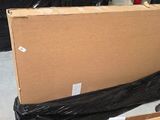 a large cardboard box sitting on the ground in a garage