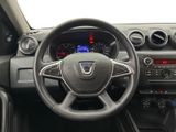 the interior of a car with a steering wheel and dashboard controls