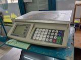 an image of a scale sitting on top of a table