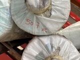 three rolls of plastic wrapped in plastic wrap on a pallet