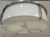 a drum that is hanging from the ceiling in the room
