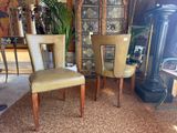 two chairs that are sitting next to each other in a room