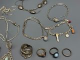 a lot of different rings and bracelets on the table