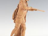 statue of a man with a gun on a white background