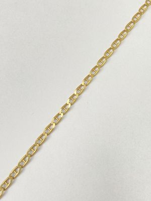 a close up of a gold chain bracelet on a white background
