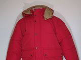 jacket on a mannequin dummy with a red coat on it