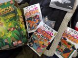a lot of books and games on the bed
