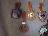 a lot of badges that are on a table