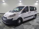 a white van that is parked on a checkered floor