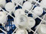 a lot of cups and saucers in a tray