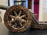a large metal object on a table with a chain around it