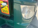 a parking meter with a warning sign on it