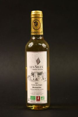 a bottle of olive oil on a black background