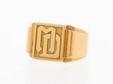 a close up of a gold ring with the letter d on it