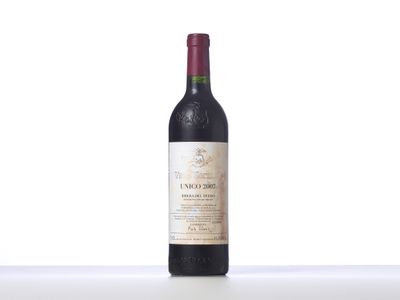 a close up of a bottle of wine sitting on a table