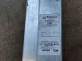 a metal box with a sticker on it sitting on the floor