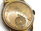 an image of a close up of a wrist watch on a white surface
