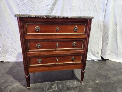 an image of a wooden chest of drawers with marble top