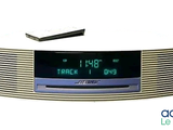 a clock that is sitting on top of a radio