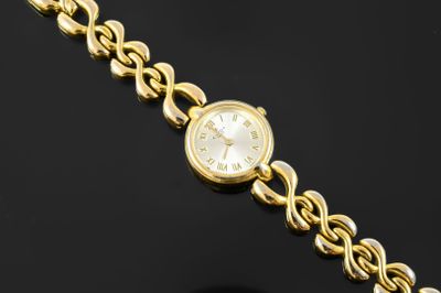 an image of a close up of a wrist watch on a black surface