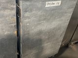 several stainless steel refrigerators stacked on top of each other in a warehouse