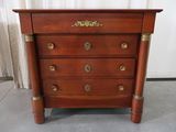 a wooden chest of drawers with brass hardware on it