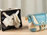 two purses that are sitting on a table